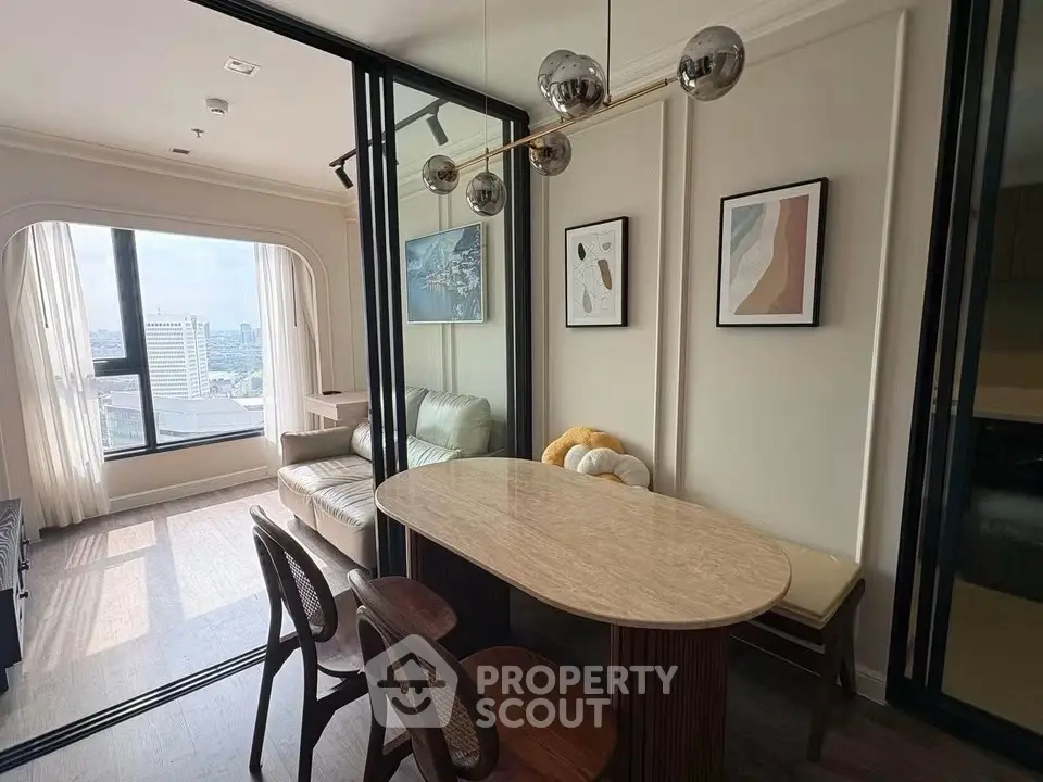 Modern living room with stylish dining area and panoramic city view, featuring elegant decor and natural light.