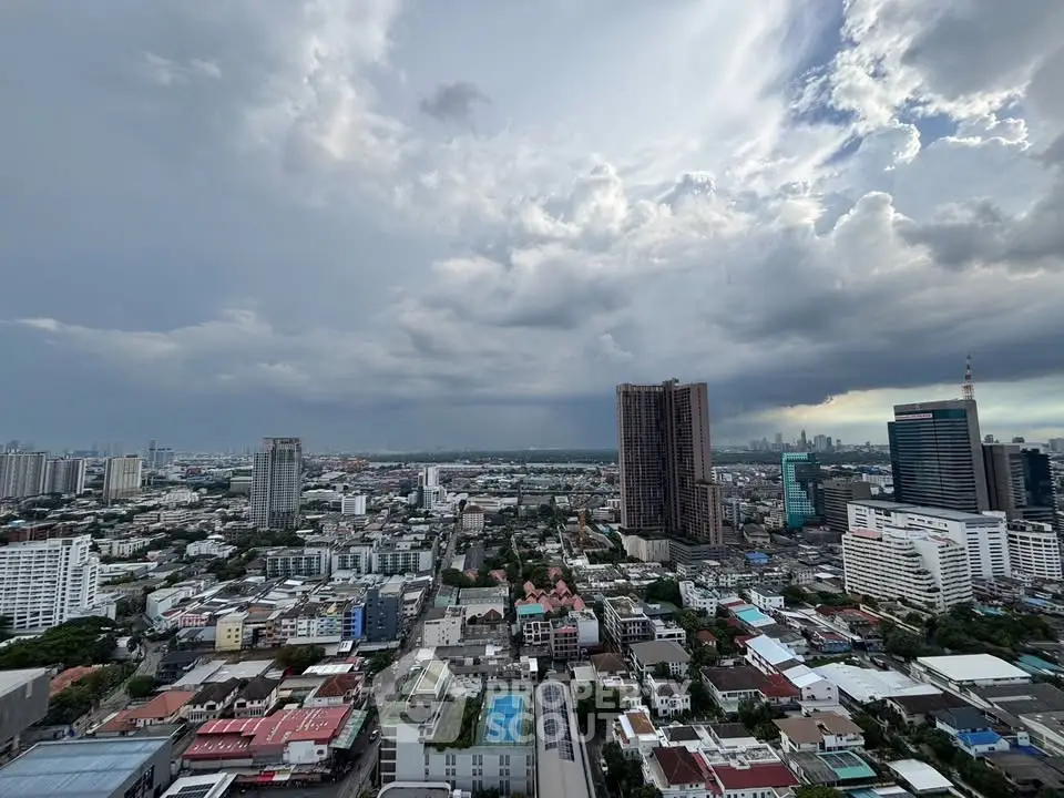 Stunning cityscape view showcasing urban skyline and dramatic clouds, perfect for high-rise living enthusiasts.