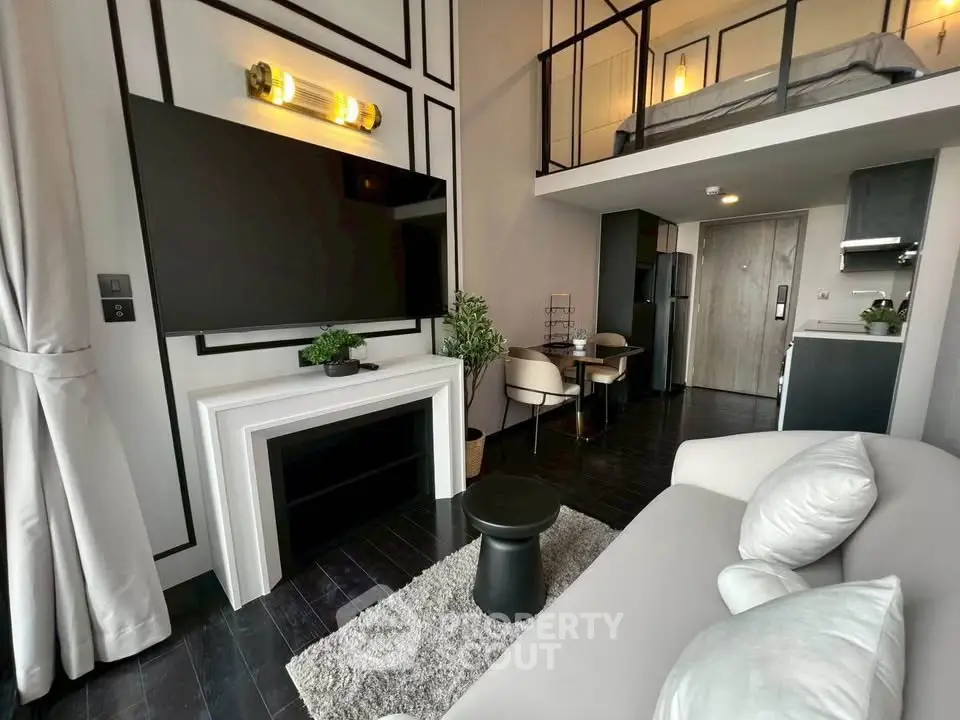 Modern loft apartment with stylish living area and mezzanine bedroom, featuring sleek decor and open layout.