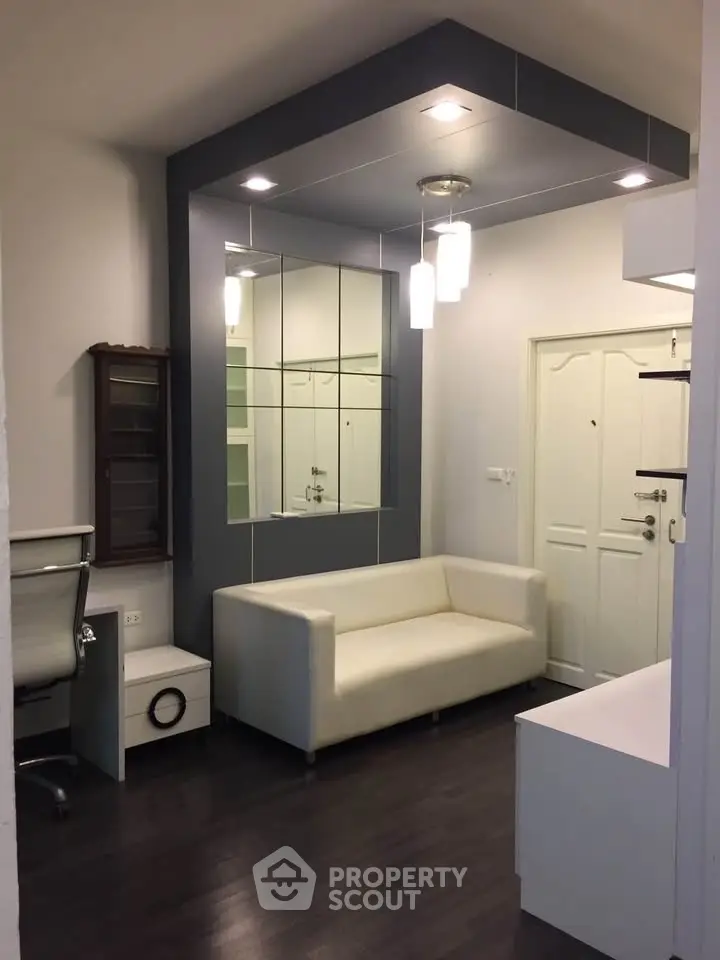 Modern living room with sleek design and elegant lighting