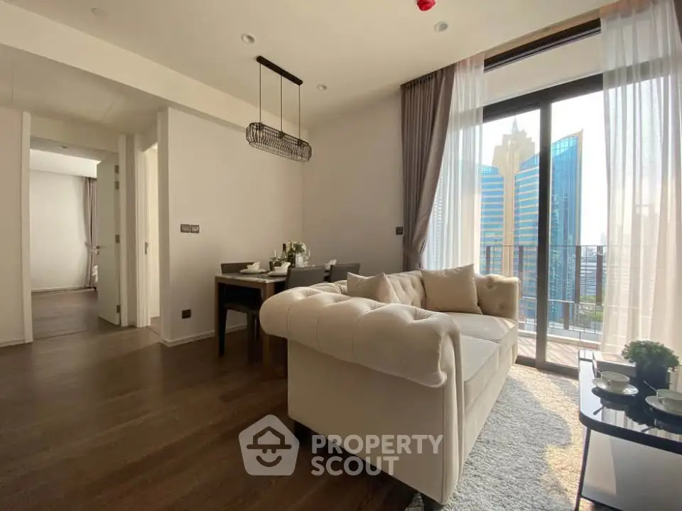 Modern living room with elegant sofa and city view balcony in luxury apartment