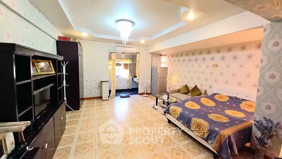 Spacious bedroom with elegant decor and modern furnishings in a cozy apartment.