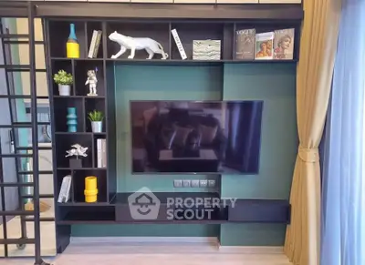 Modern living room with stylish TV unit and decorative shelving