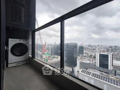 Stunning cityscape view from high-rise balcony with washing machine