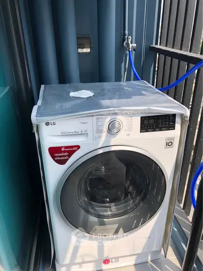 Modern washing machine on a balcony with sleek design and efficient features.