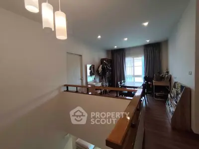 Spacious modern living room with stylish lighting and wooden flooring