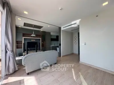 Spacious modern living room with natural light and stylish decor