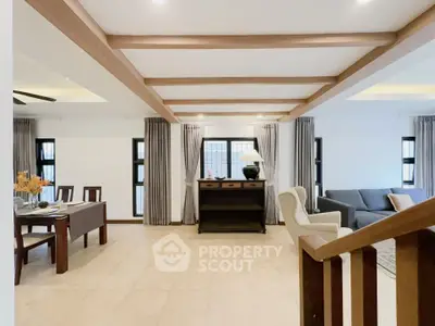 Spacious living room with modern decor and natural light