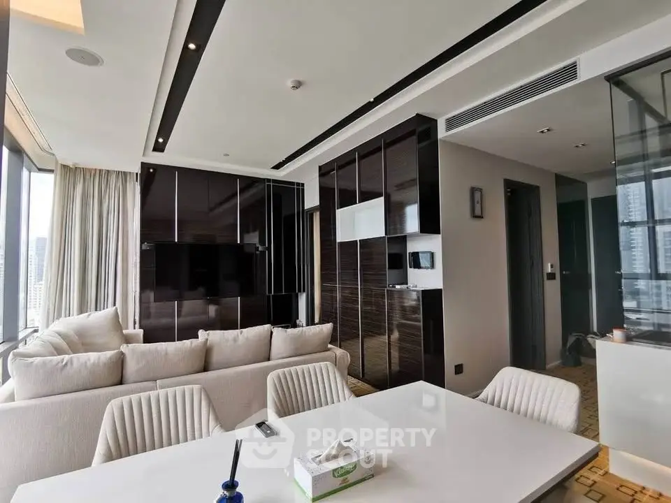Luxurious modern living room with sleek design and panoramic city views.