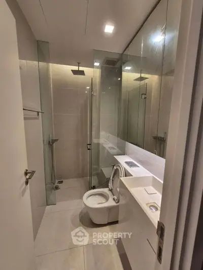 Modern bathroom with glass shower and sleek fixtures