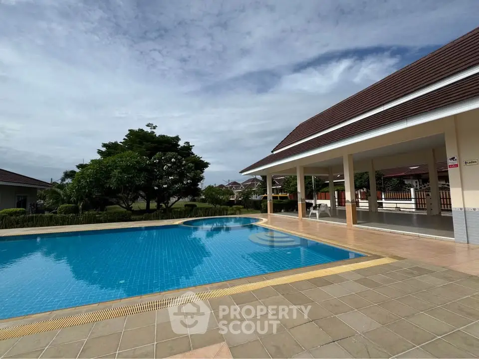Luxurious villa with a stunning outdoor pool and spacious patio, perfect for relaxation and entertainment.