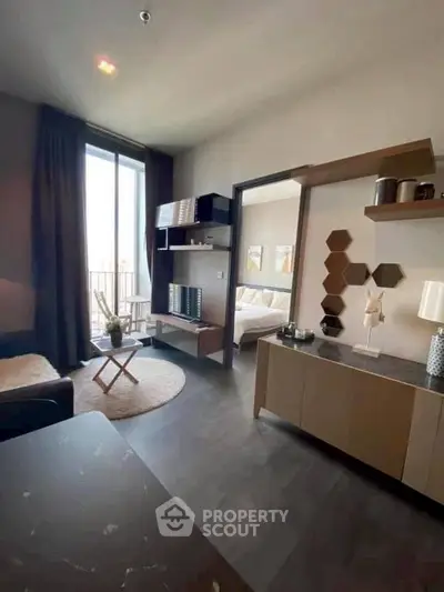 Modern living room with stylish decor and natural light in a contemporary apartment.