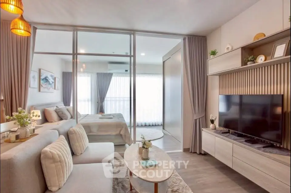 Modern open-plan living room with cozy seating and stylish decor
