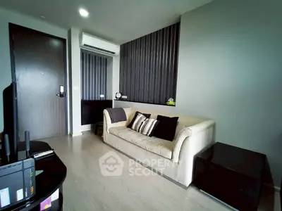 Modern living room with sleek design and neutral tones, featuring a comfortable sofa and stylish decor.