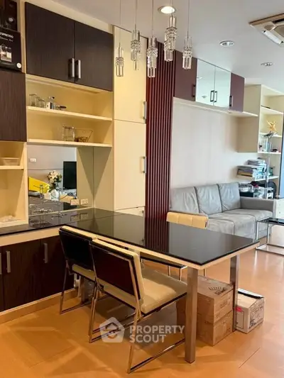 Modern living room with sleek furniture and stylish shelving in a contemporary apartment.