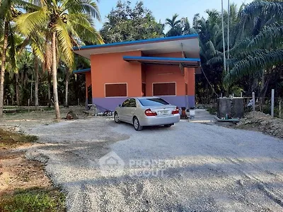 Charming rural property with vibrant exterior and lush surroundings, perfect for serene living.
