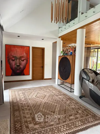 Stunning modern living room with unique art and stylish decor, featuring high ceilings and elegant wooden accents.