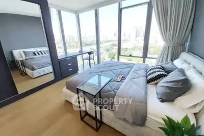 Luxurious bedroom with panoramic city views and modern decor