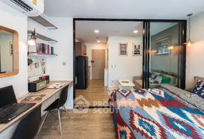 Modern studio apartment with stylish decor and functional workspace