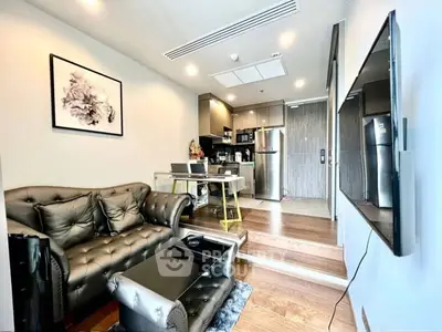 Modern living room with open kitchen and stylish decor