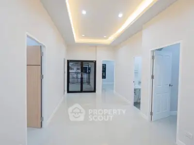 Spacious modern interior with sleek lighting and glossy floors, perfect for contemporary living.