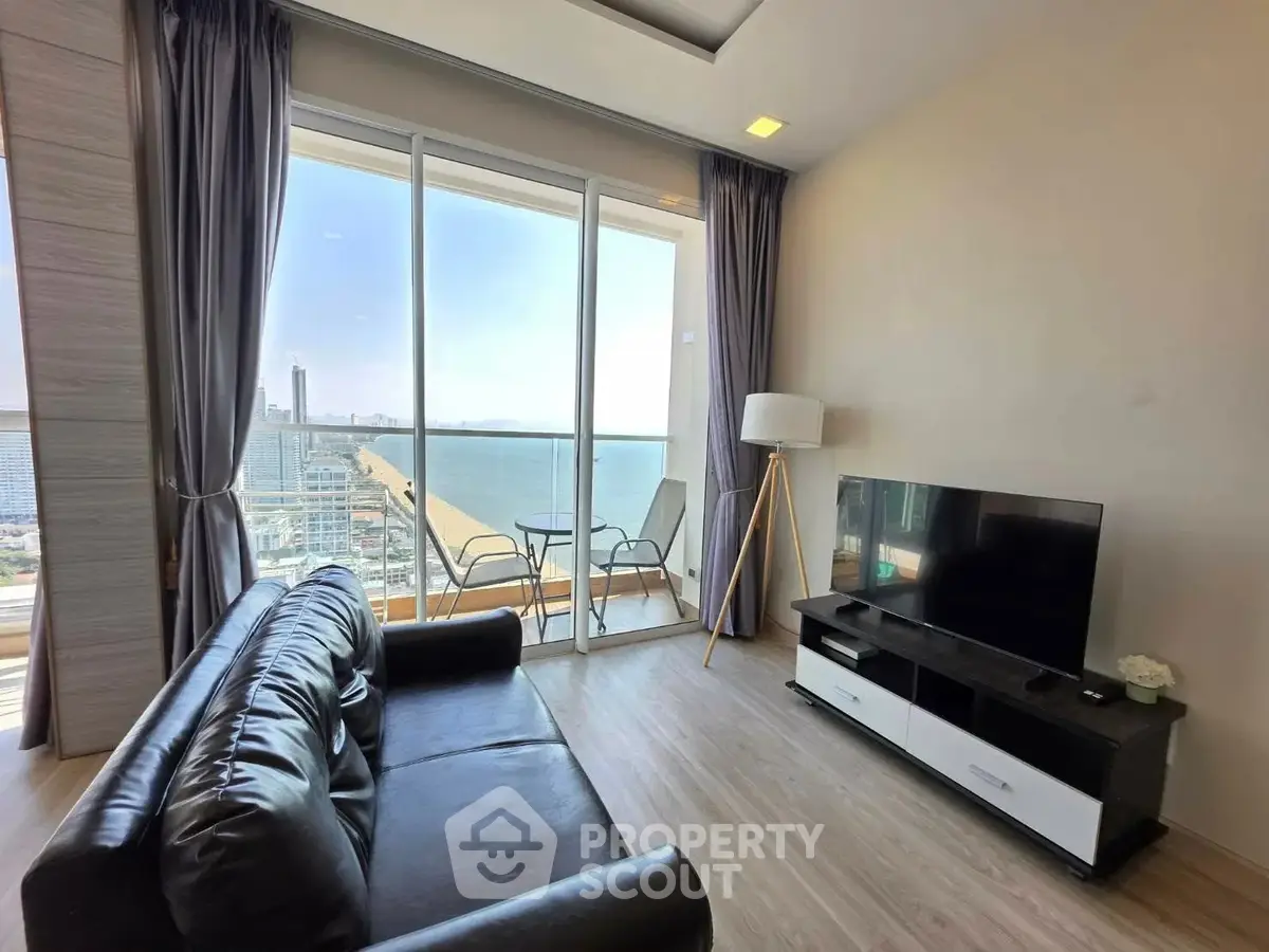 Modern living room with stunning ocean view and sleek furnishings