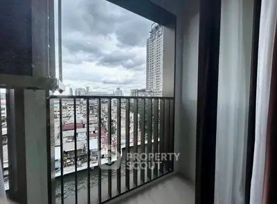 Urban balcony with cityscape view, perfect for enjoying skyline vistas and fresh air in a bustling environment.