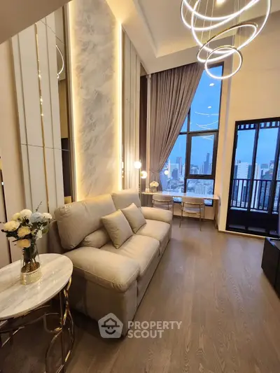 Luxurious modern living room with elegant lighting and city view balcony.