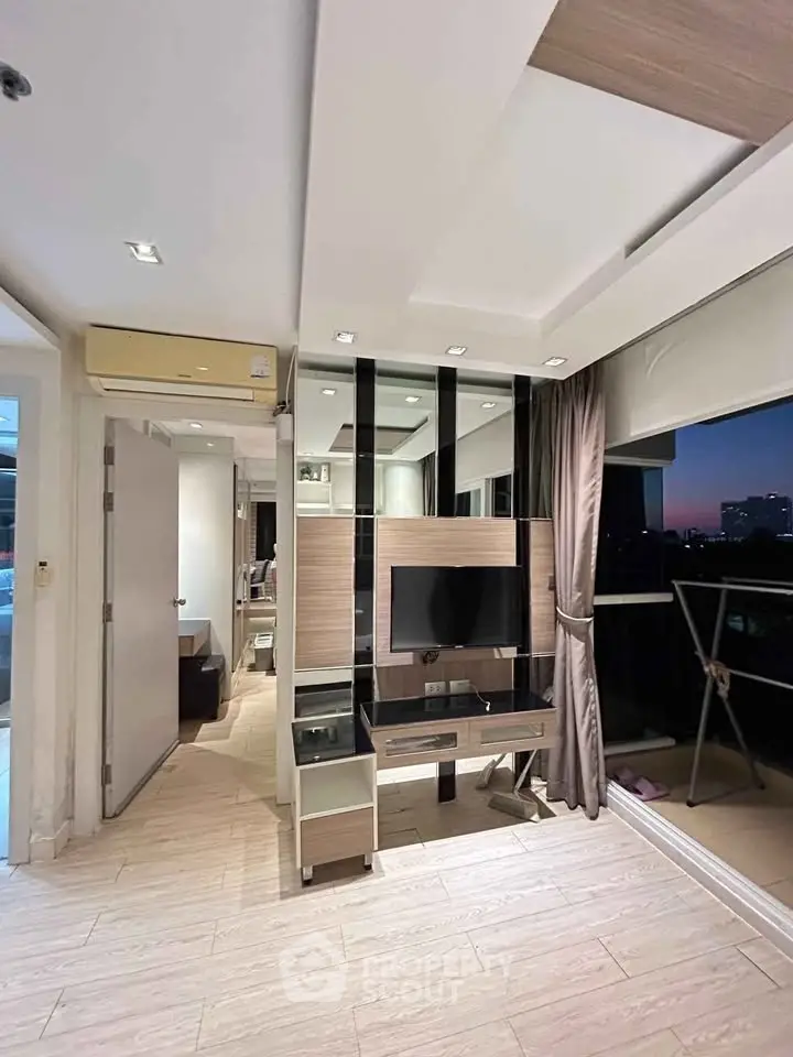 Modern living room with sleek design and city view balcony