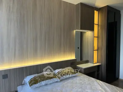 Modern bedroom with stylish wood paneling and ambient lighting