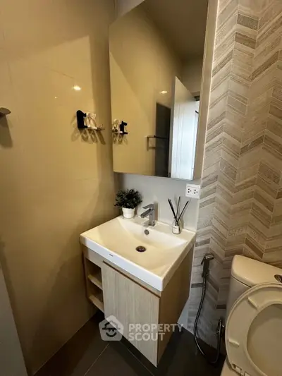 Modern bathroom with sleek sink and stylish tile design