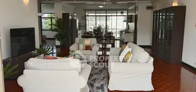 Spacious living room with cozy seating and elegant decor in a modern home.