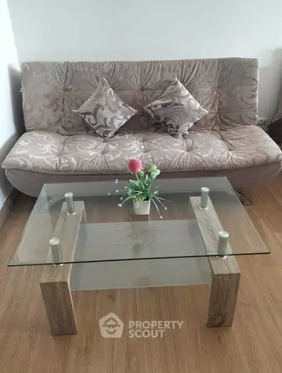 Stylish living room with elegant sofa and modern glass coffee table