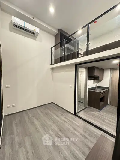Modern loft apartment with sleek kitchen and mezzanine level