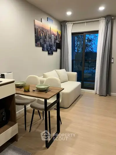 Modern living room with stylish decor and large window view