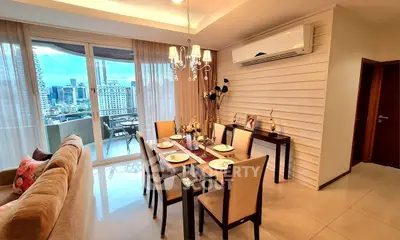 Elegant dining area with city view and modern decor in luxury apartment
