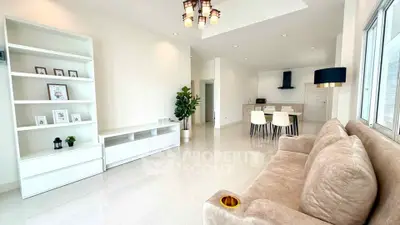 Spacious modern living room with open kitchen and elegant decor