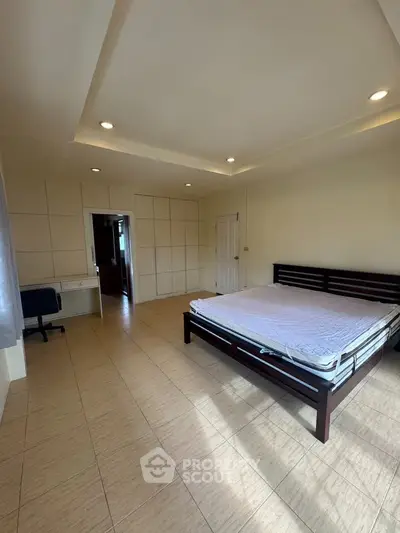 Spacious bedroom with modern design and natural light