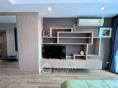 Modern living room with stylish wooden shelving and air conditioning unit