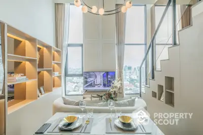 Luxurious modern living room with high ceilings and city view, featuring elegant decor and stylish staircase.