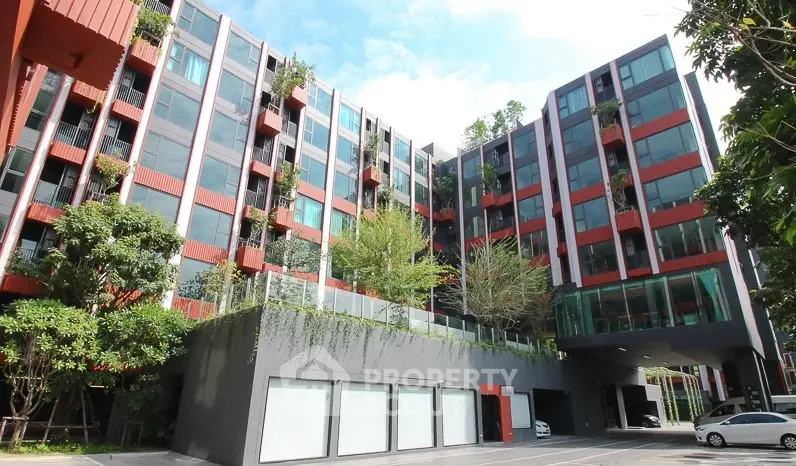 Modern residential building with lush greenery and spacious balconies