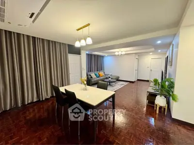 Spacious living room with elegant dining area and modern decor