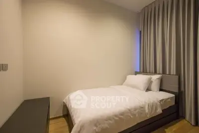 Cozy minimalist bedroom with modern decor and soft lighting