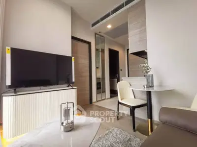 Modern living room with sleek furniture and stylish decor in a contemporary apartment.