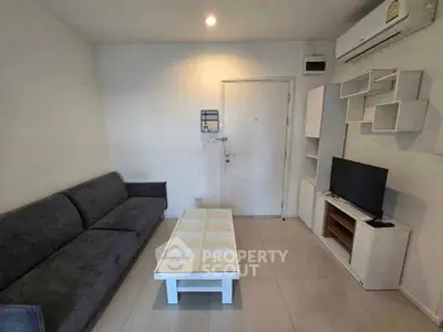 Modern living room with sleek furniture and air conditioning, perfect for cozy urban living.