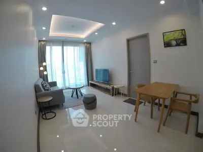 Modern living room with sleek furniture and large windows in a stylish apartment.