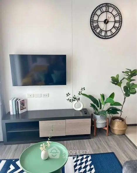 Stylish living room with modern decor and wall-mounted TV