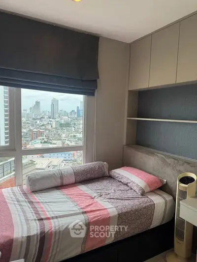 Cozy bedroom with city view and modern decor