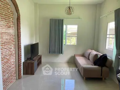 Spacious living room with modern decor and natural light