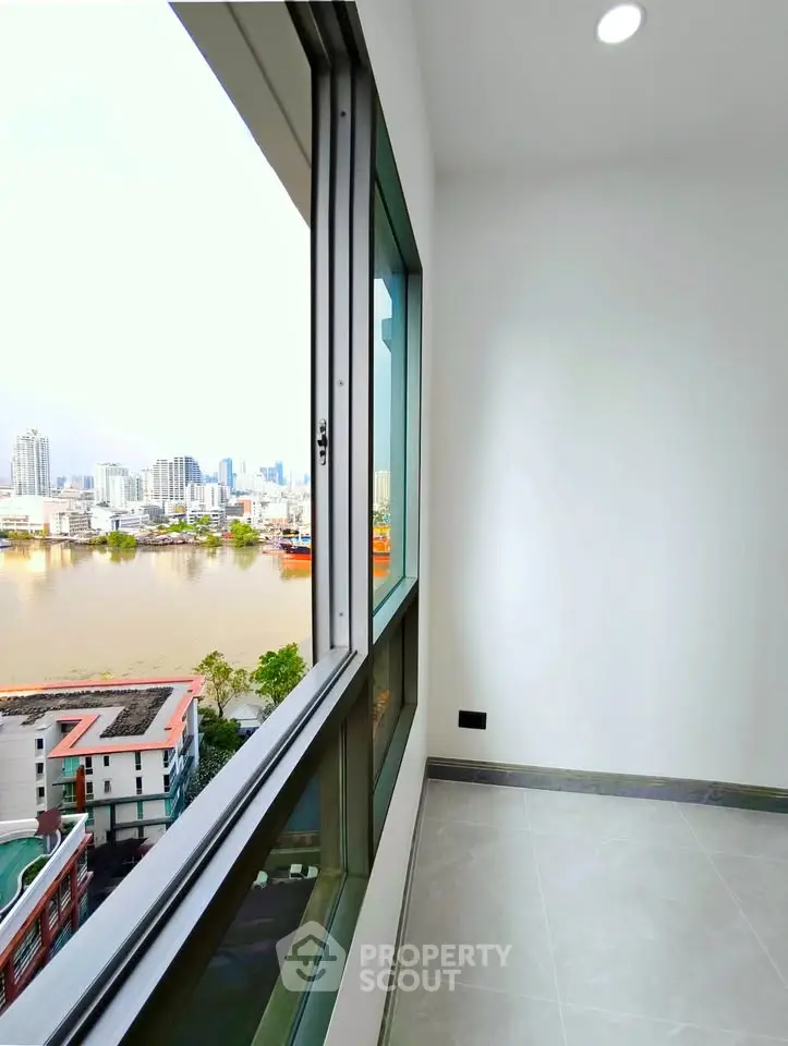 Stunning river view from a modern high-rise balcony, perfect for urban living.